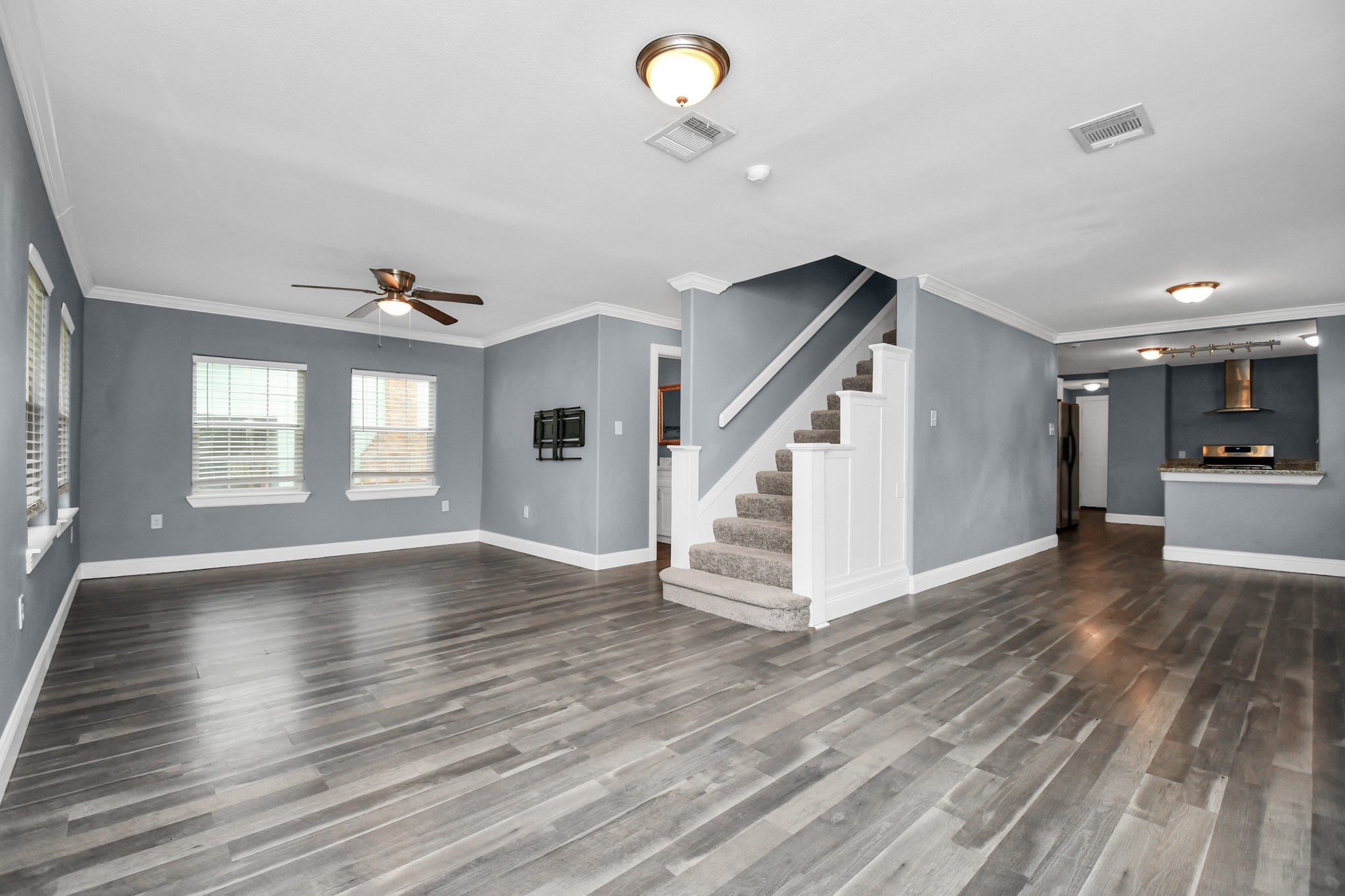 3217 Michigan Street Baytown, TX 77520 - Photo 8 of 37 a view of empty room with wooden floor and fan