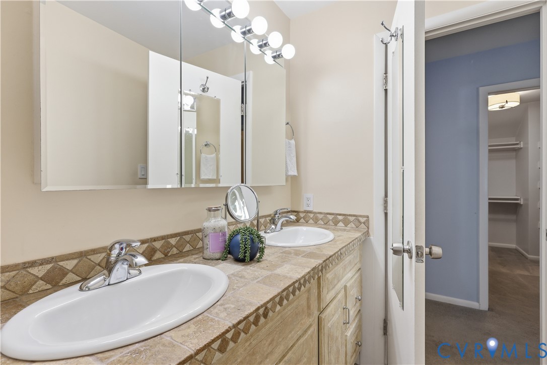 13622 Winterberry Ridge Midlothian, VA 23112 - Photo 22 of 47 a bathroom with a granite countertop sink and a mirror