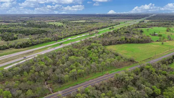 a view of a field with an ocean