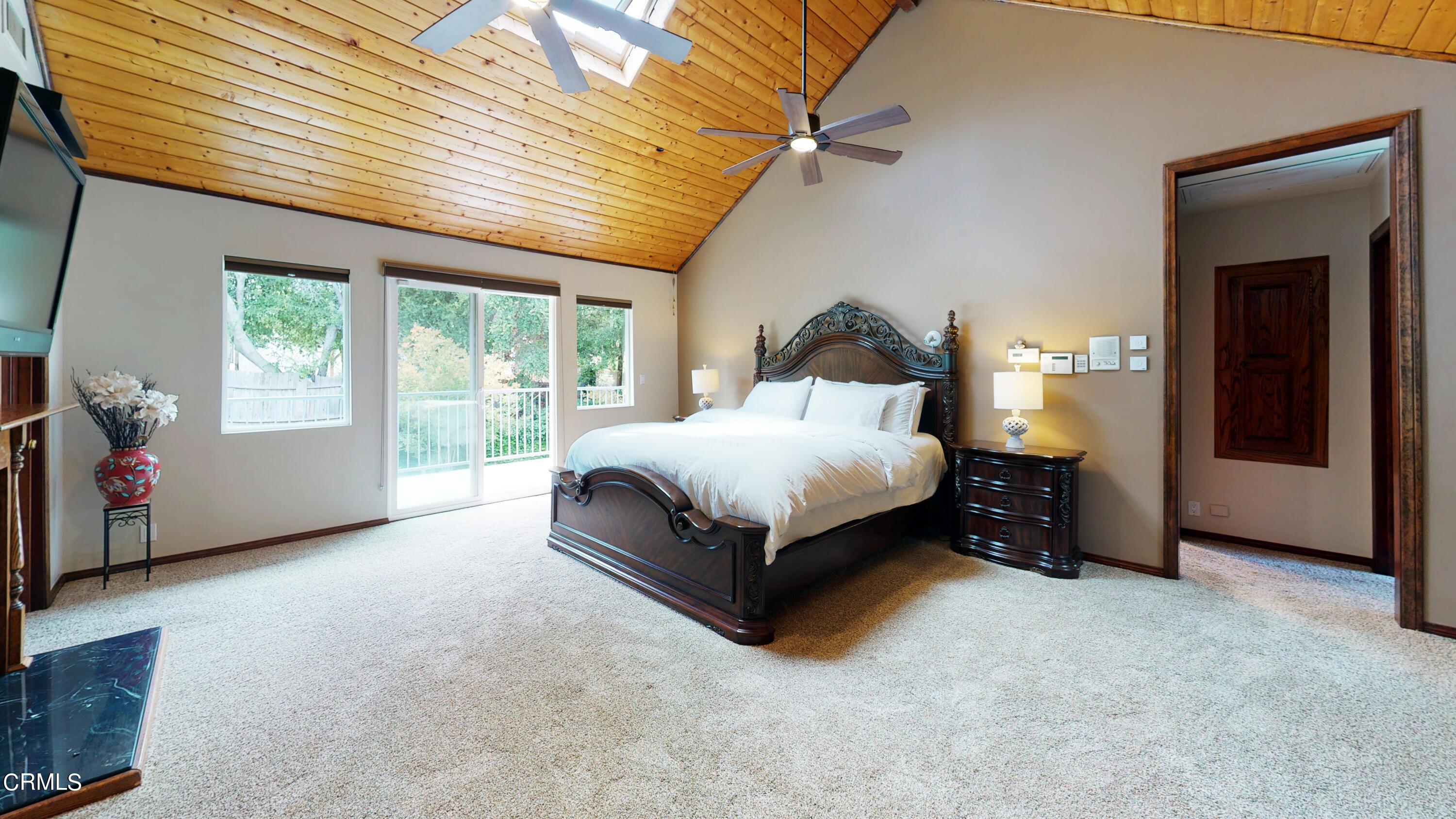 25049 Highspring Avenue Newhall, CA 91321 - Photo 13 of 52 a spacious bedroom with a bed and a large window