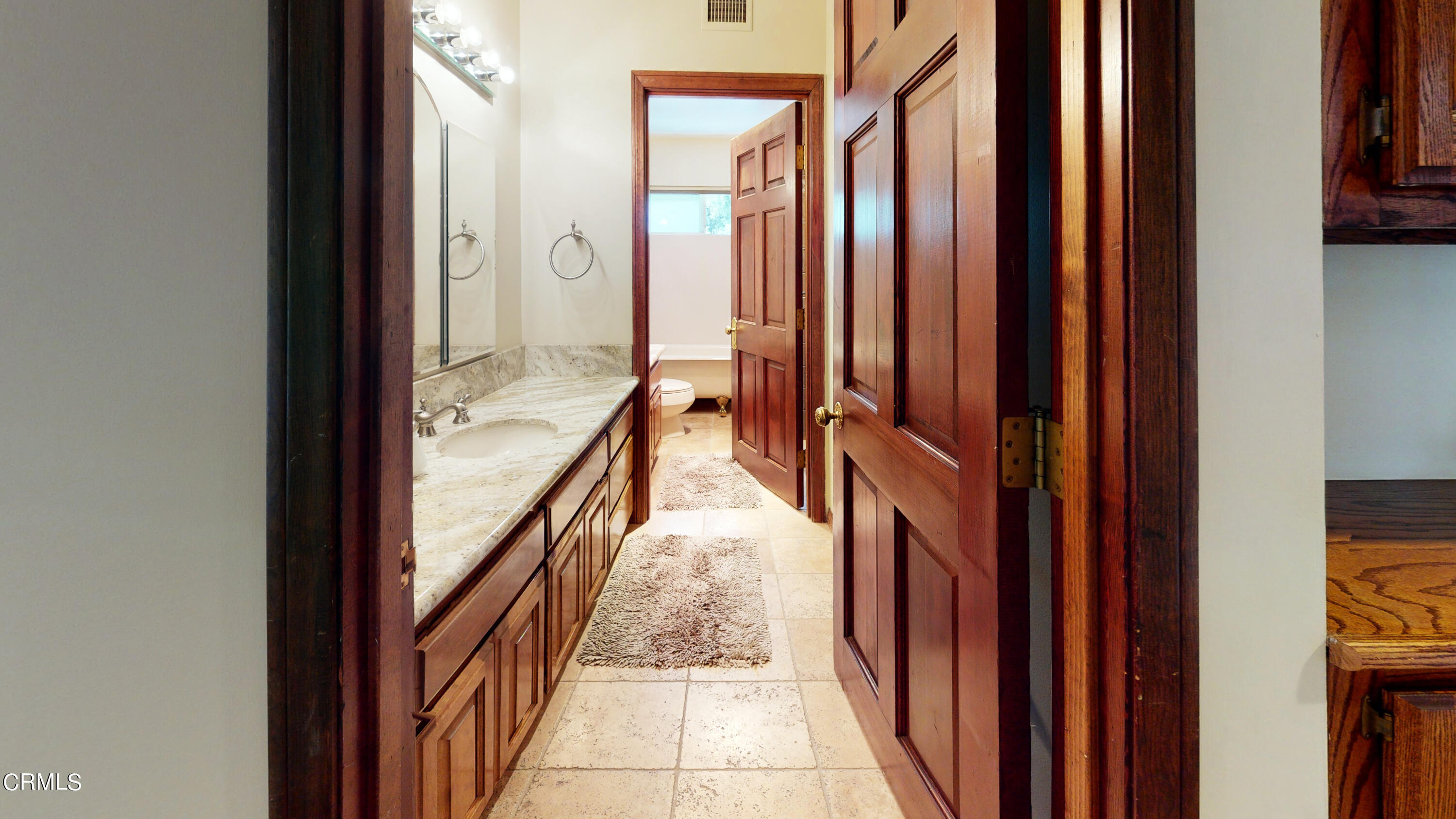 25049 Highspring Avenue Newhall, CA 91321 - Photo 20 of 52 a view of a hallway with wooden floor and staircase