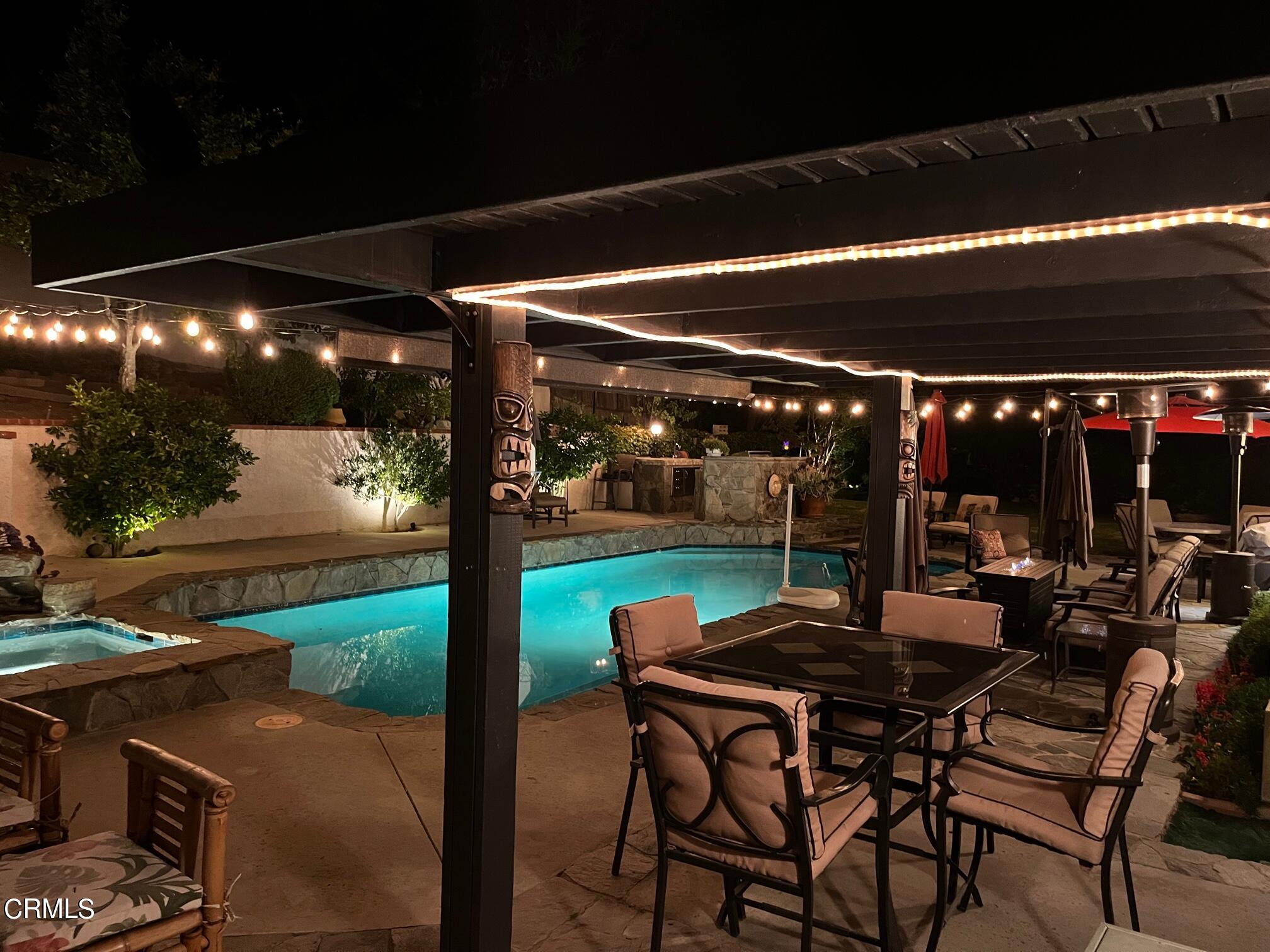 25049 Highspring Avenue Newhall, CA 91321 - Photo 42 of 52 a view of a patio with table and chairs and potted plants