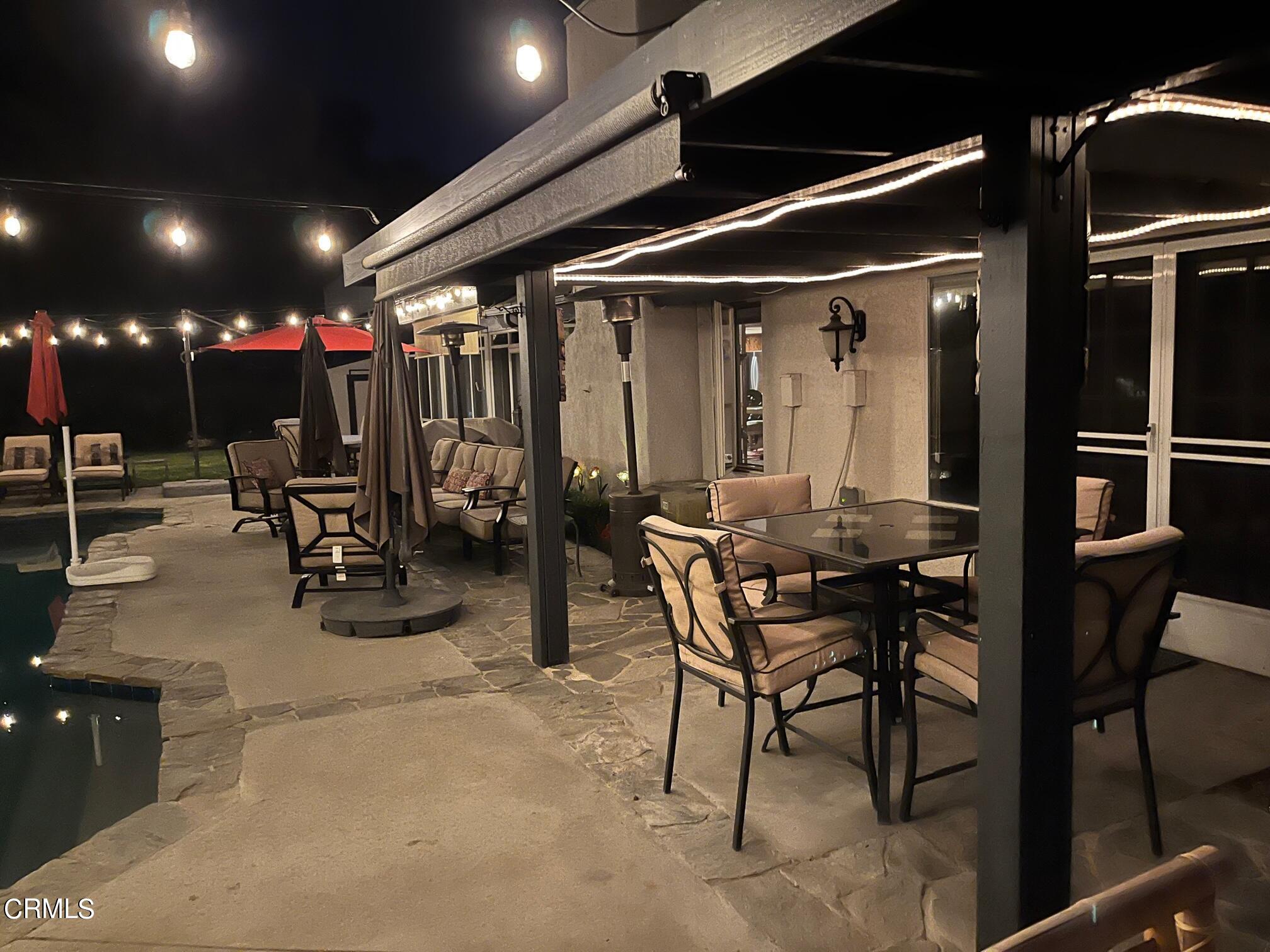 25049 Highspring Avenue Newhall, CA 91321 - Photo 45 of 52 a view of a dining room with furniture