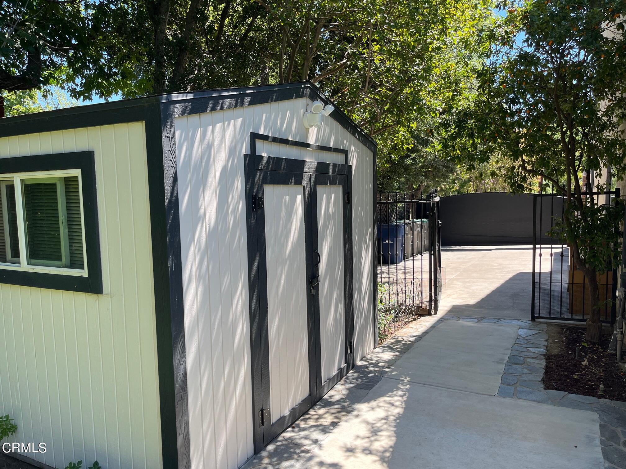 25049 Highspring Avenue Newhall, CA 91321 - Photo 50 of 52 a side view of a house with a yard