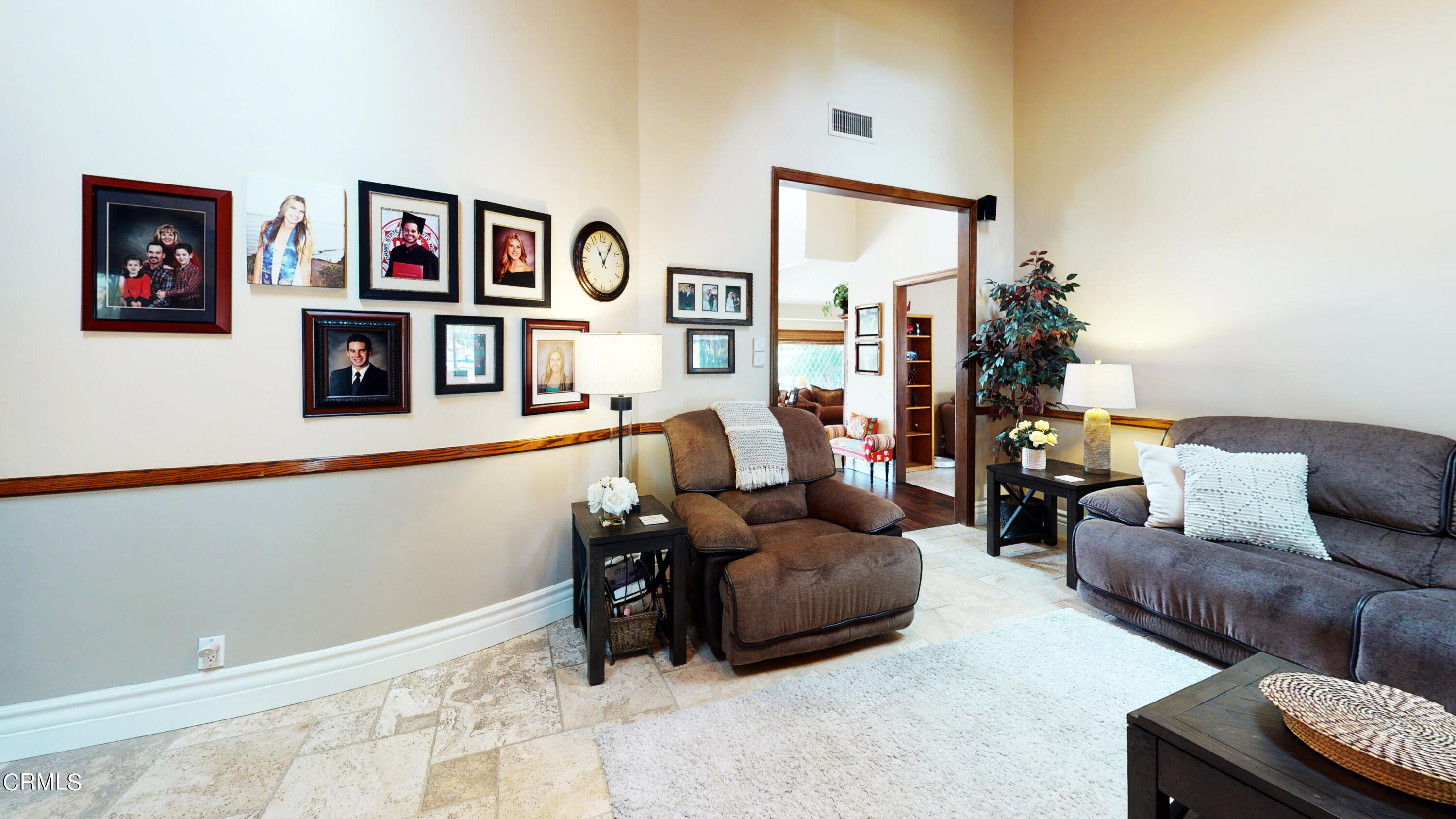 25049 Highspring Avenue Newhall, CA 91321 - Photo 8 of 52 a living room with furniture and a bookshelf