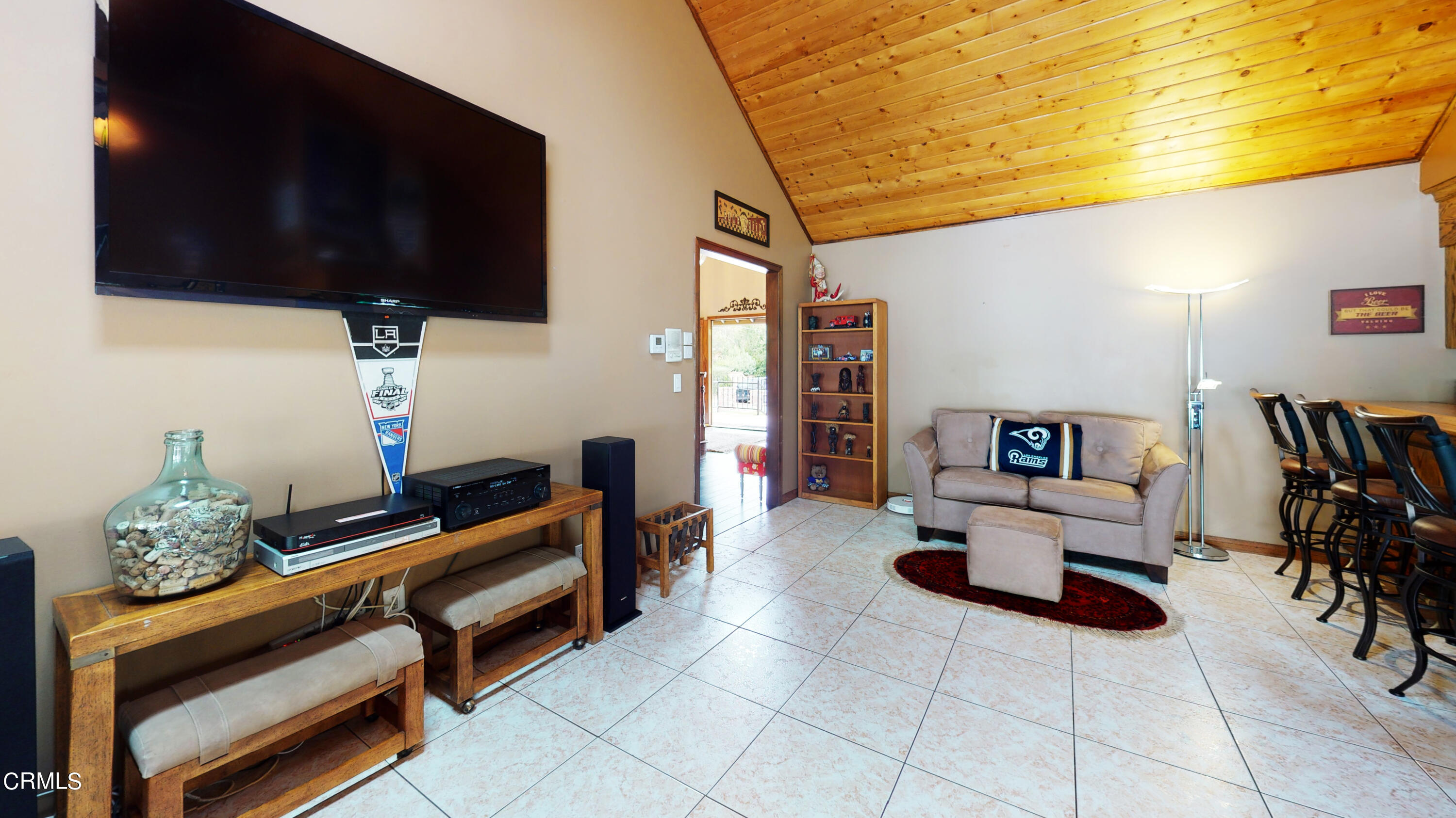 25049 Highspring Avenue Newhall, CA 91321 - Photo 9 of 52 a living room with furniture and a flat screen tv