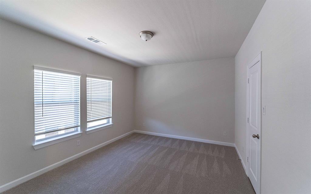 1907 Rondinella Drive Rockwall, TX 75032 - Photo 14 of 21 a view of an empty room with a window