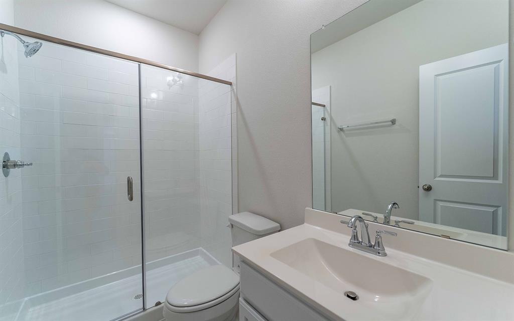 1907 Rondinella Drive Rockwall, TX 75032 - Photo 15 of 21 a bathroom with a sink toilet and shower