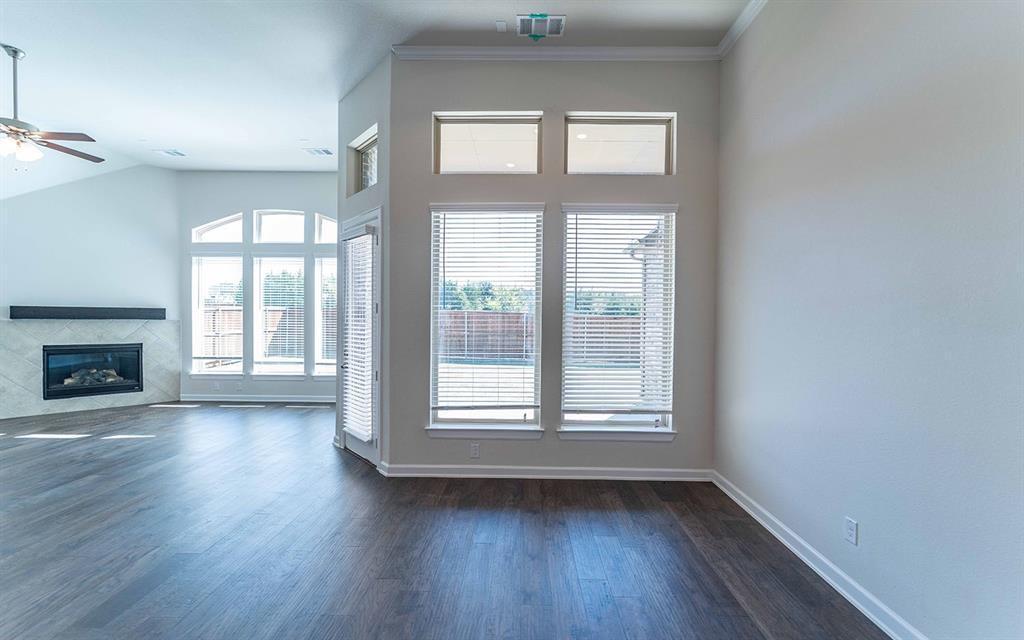 1907 Rondinella Drive Rockwall, TX 75032 - Photo 5 of 21 a view of an empty room with wooden floor and a window
