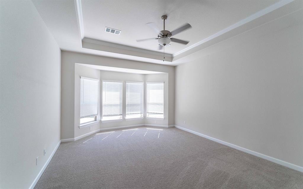 1907 Rondinella Drive Rockwall, TX 75032 - Photo 9 of 21 a view of an empty room with a chandelier fan