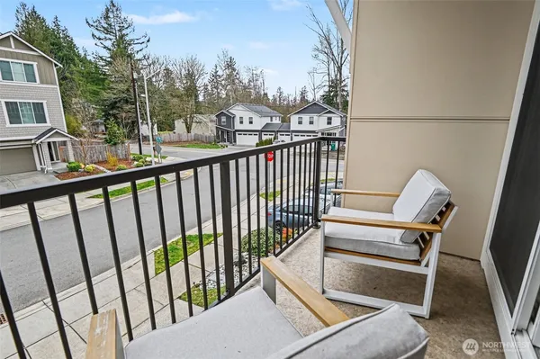 a view of balcony with furniture