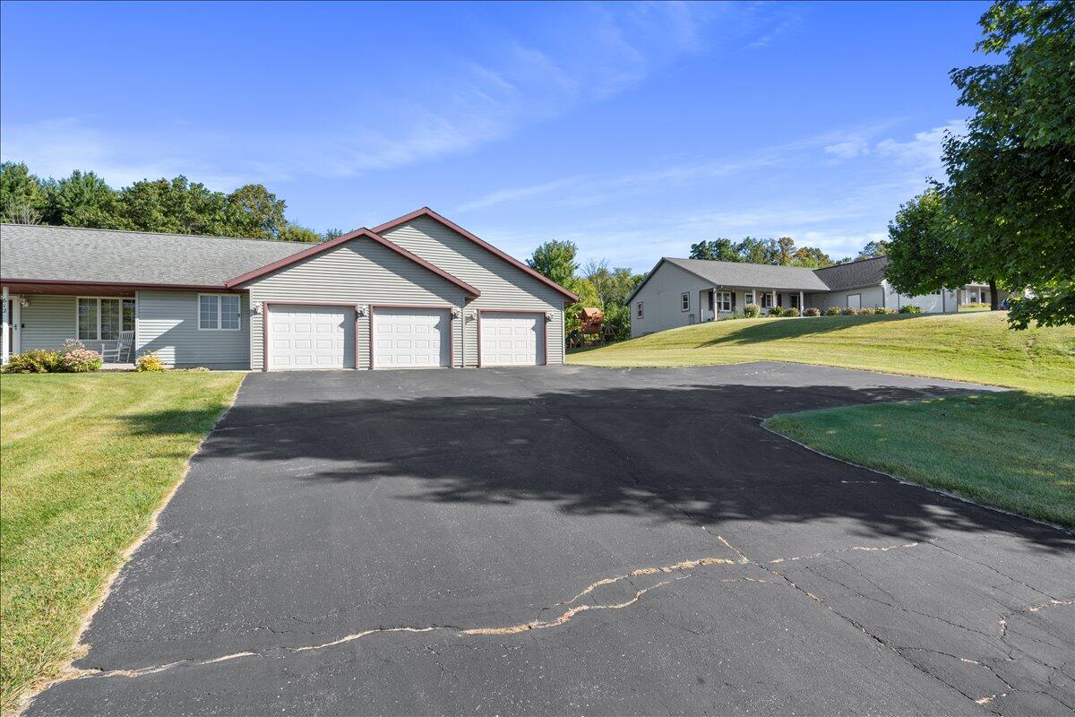 612 Bobolink Lane Cascade, WI 53011 - Photo 54 of 65 Black Top Driveway