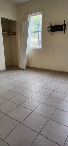 a view of a refrigerator and window in a room