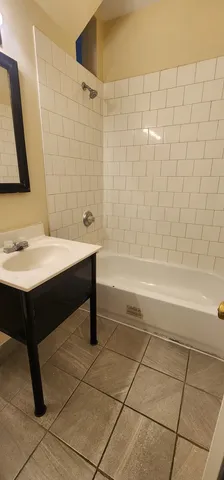a bathroom with a sink and a bathtub