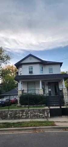 a view of house with a swimming pool