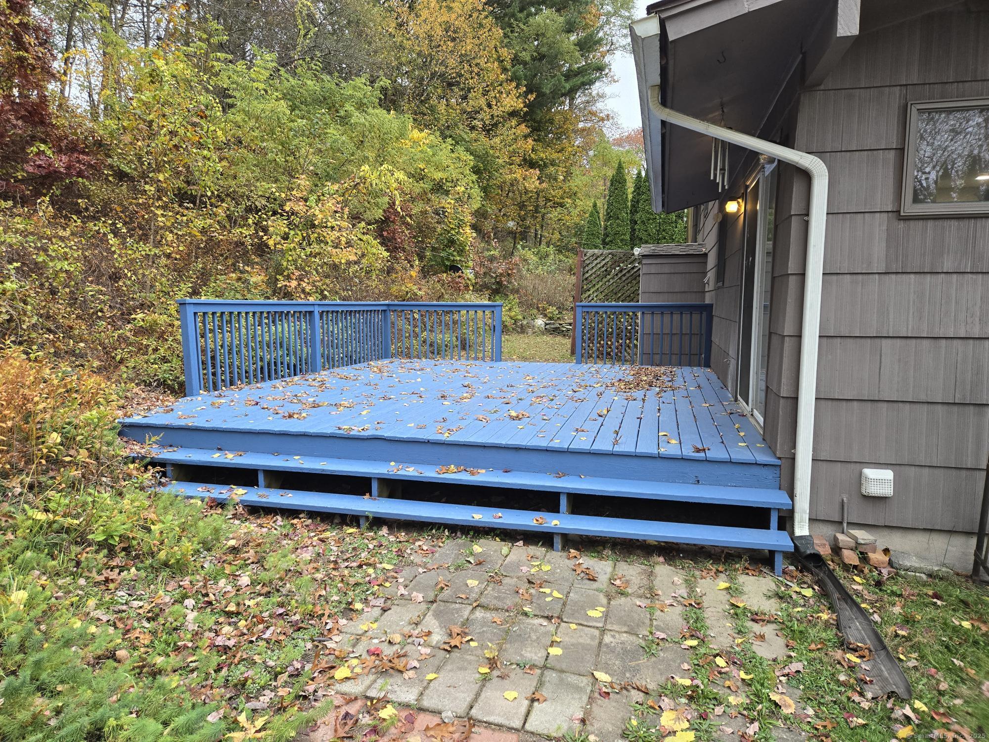 109 Mountain Spring Road Tolland, CT 06084 - Photo 26 of 33 a wooden bench sitting in front of a building