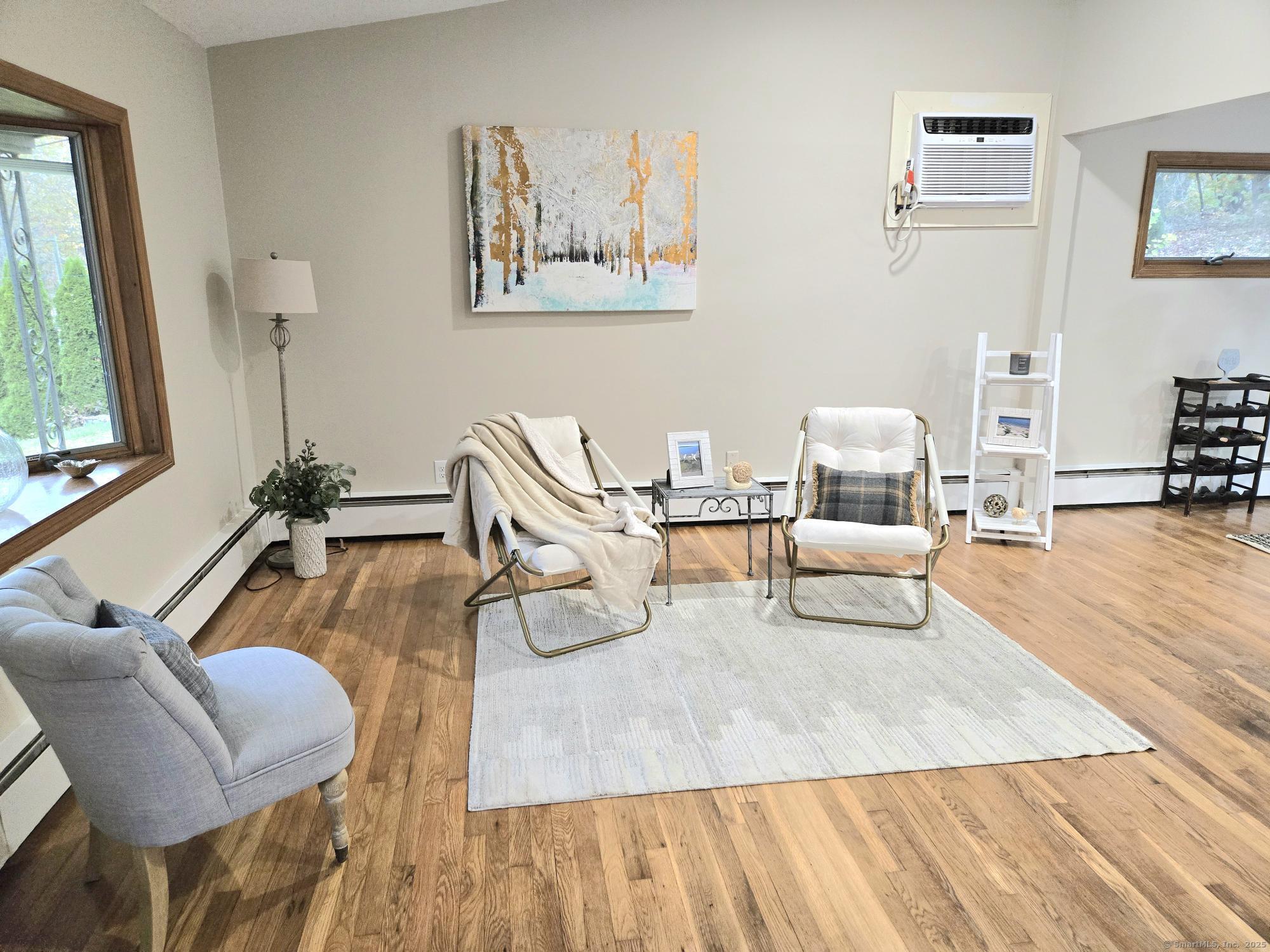 109 Mountain Spring Road Tolland, CT 06084 - Photo 7 of 33 a living room with furniture and a large window