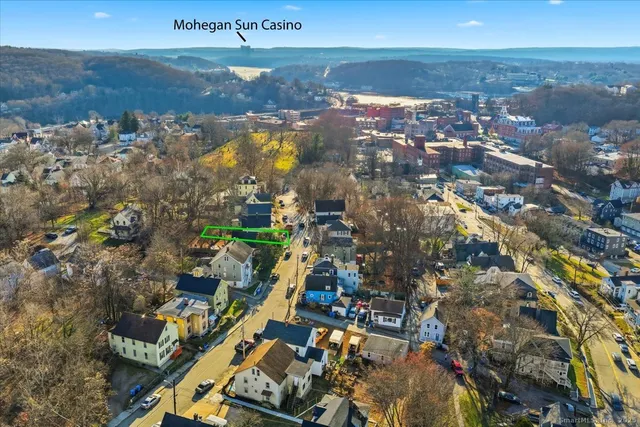 an aerial view of residential houses with outdoor space