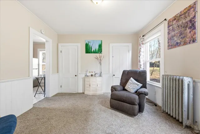 a living room with furniture and a window