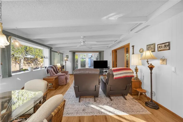 a bathroom with a sink and mirror with bathtub