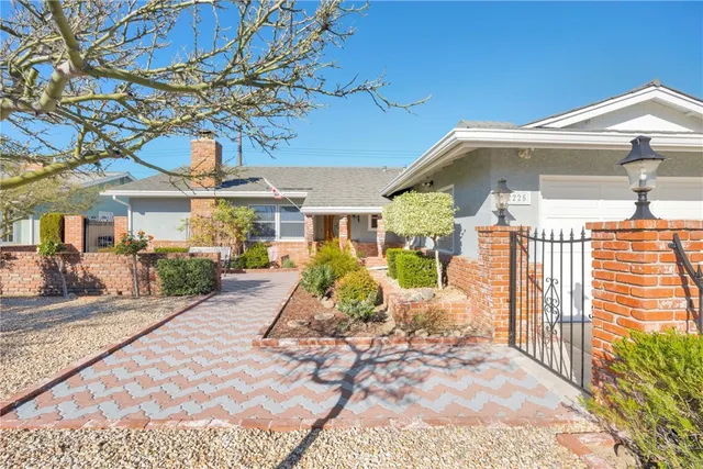 a living room with furniture and a lamp