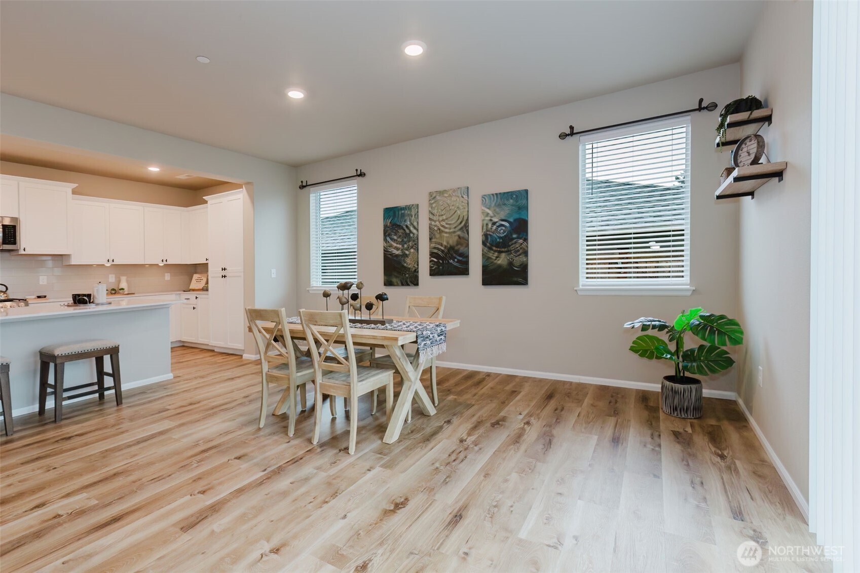 916 Baker Heights Loop Bremerton, WA 98312 - Photo 14 of 40 a dining room with furniture potted plants and wooden floor