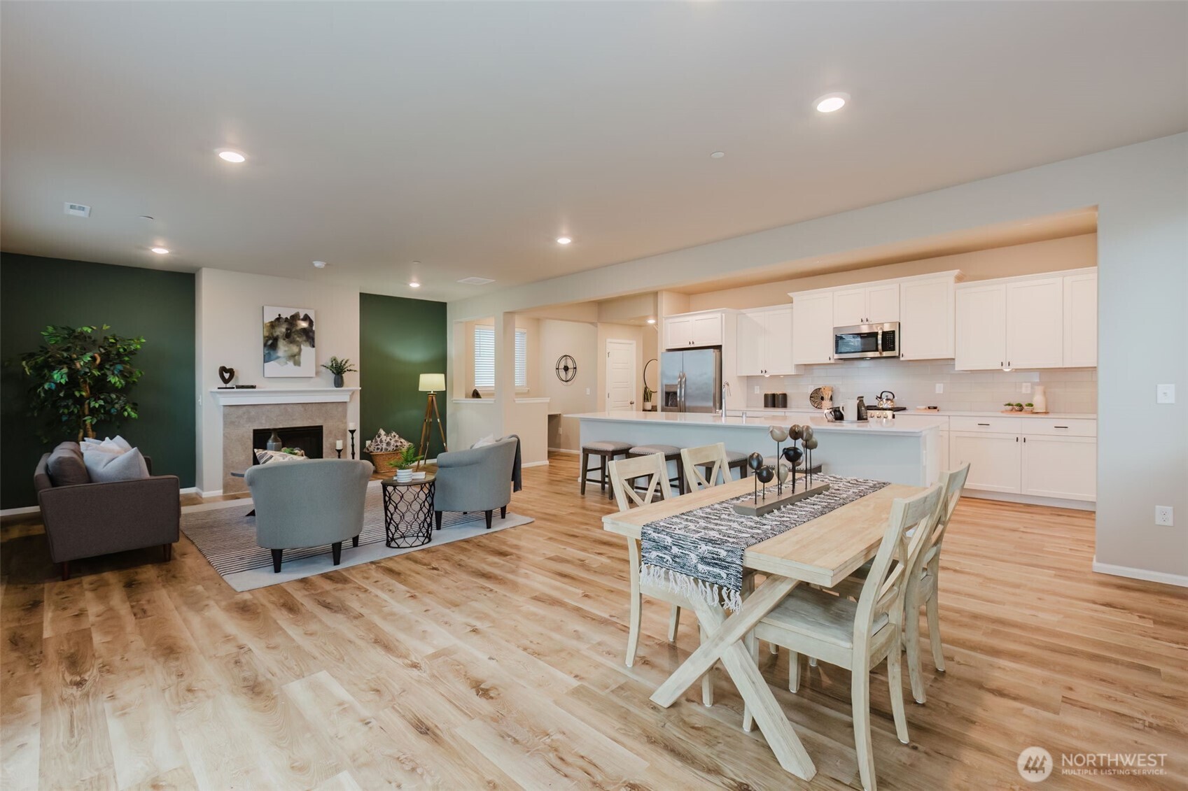 916 Baker Heights Loop Bremerton, WA 98312 - Photo 15 of 40 a view of a dining room with furniture window and wooden floor