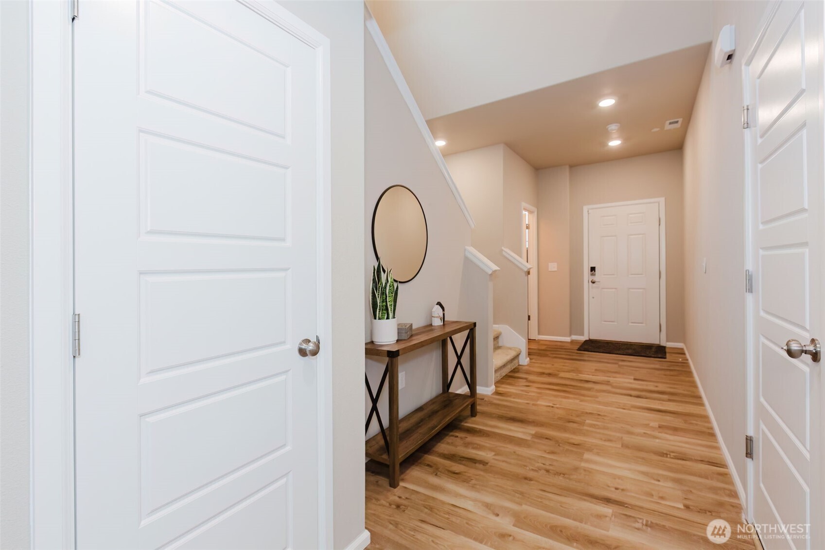 916 Baker Heights Loop Bremerton, WA 98312 - Photo 2 of 40 a view of a hallway with wooden floor