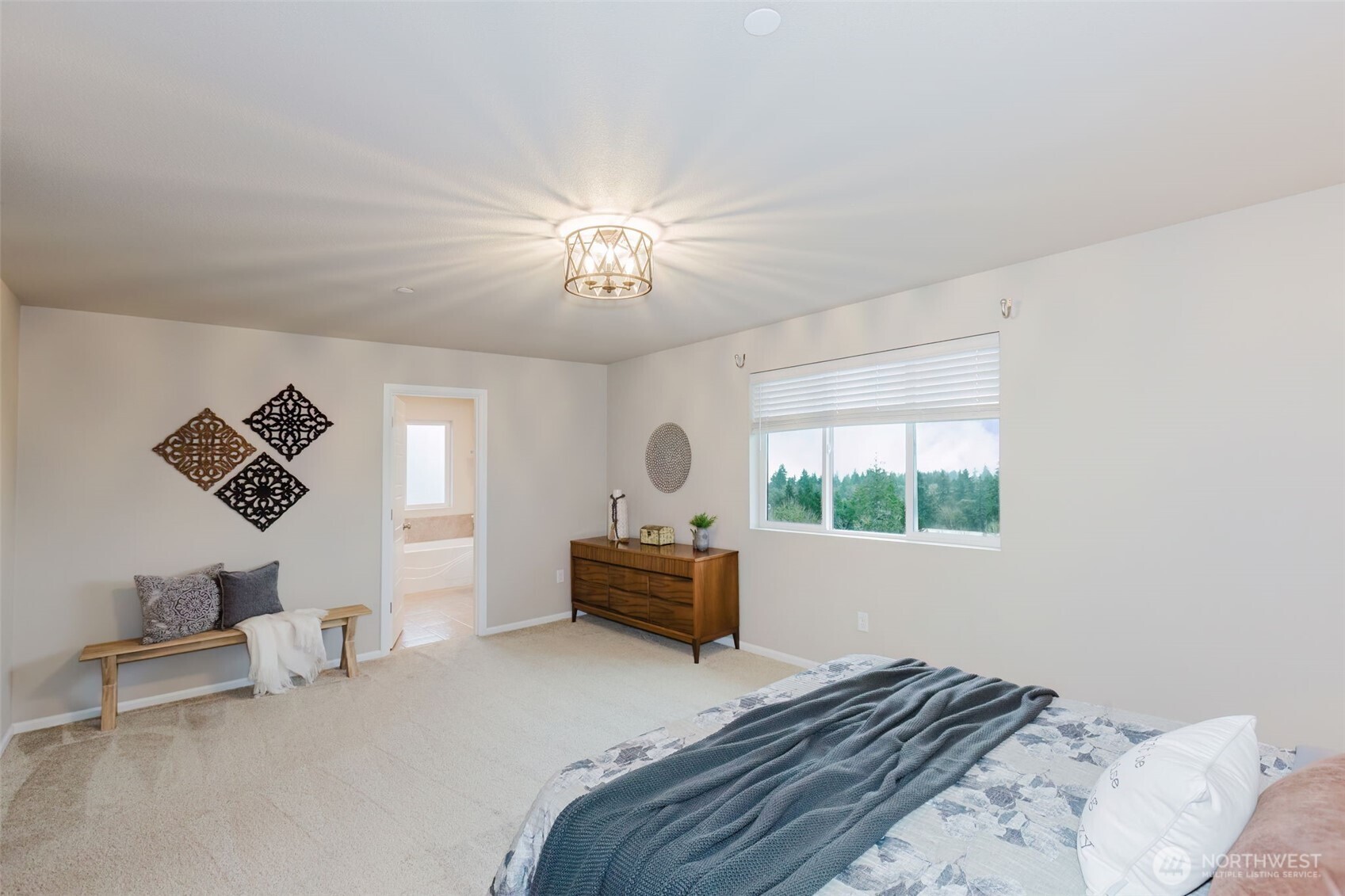 916 Baker Heights Loop Bremerton, WA 98312 - Photo 22 of 40 a bedroom with a bed and a chandelier
