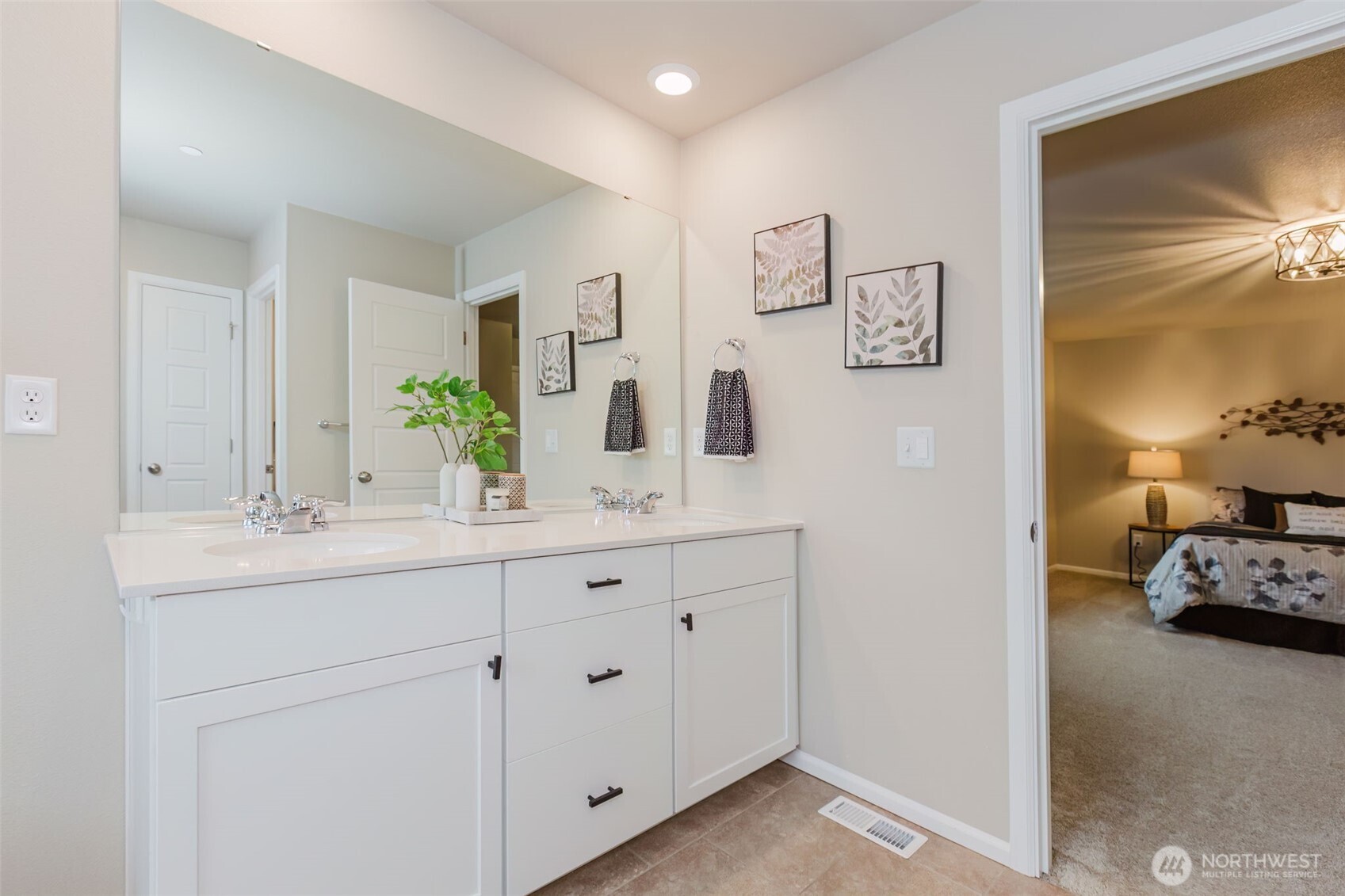 916 Baker Heights Loop Bremerton, WA 98312 - Photo 26 of 40 a en suite bathroom with double sink and a mirror