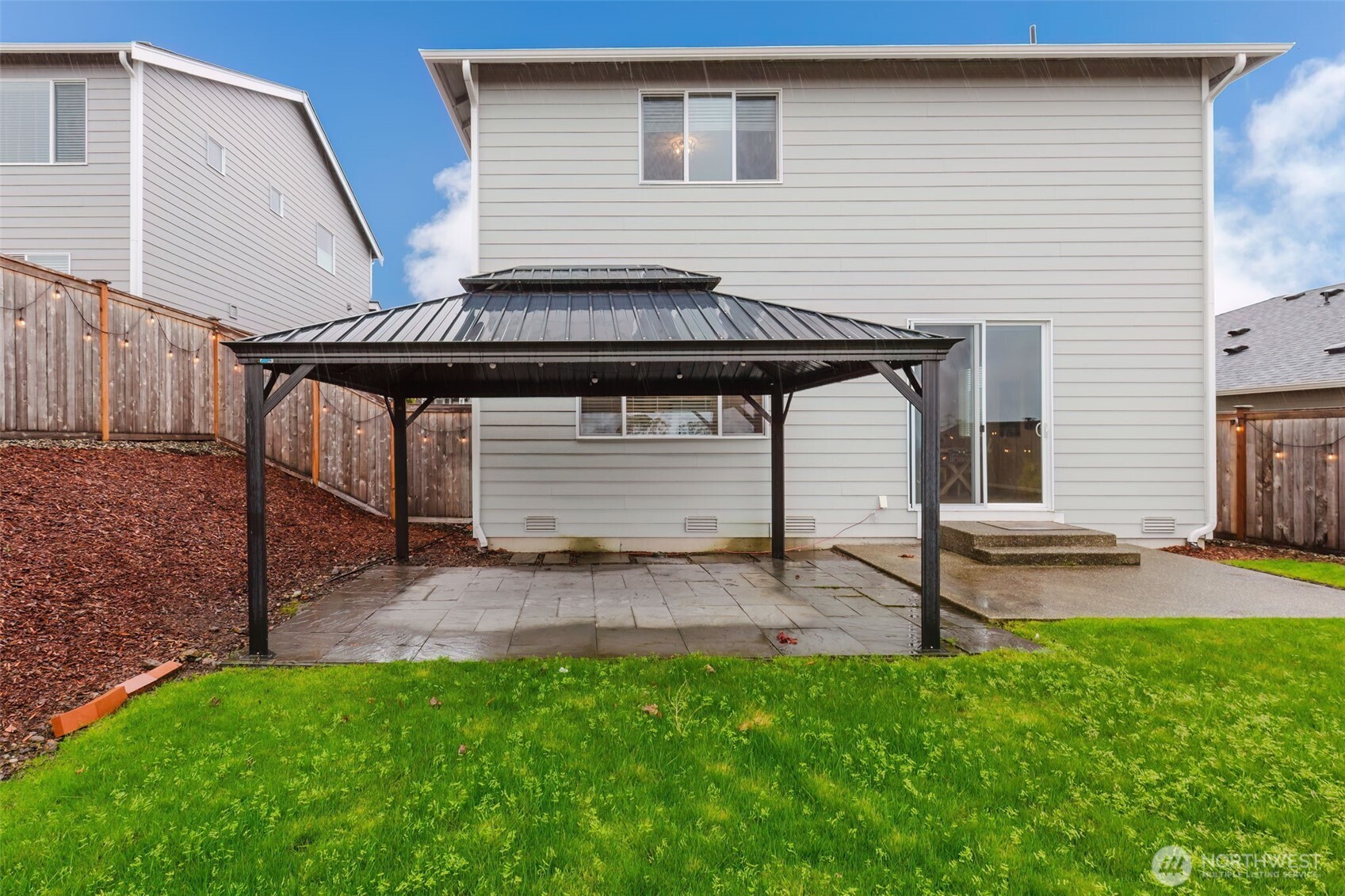 916 Baker Heights Loop Bremerton, WA 98312 - Photo 39 of 40 a view of backyard with a table and chairs