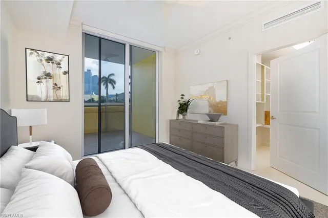 a bedroom with a bed and a cabinets