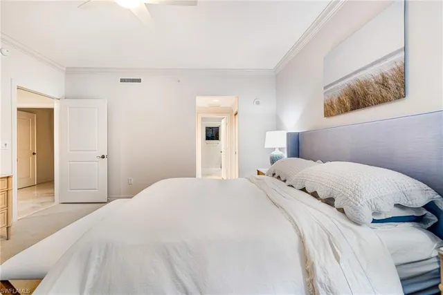 a bedroom with a bed and a painting