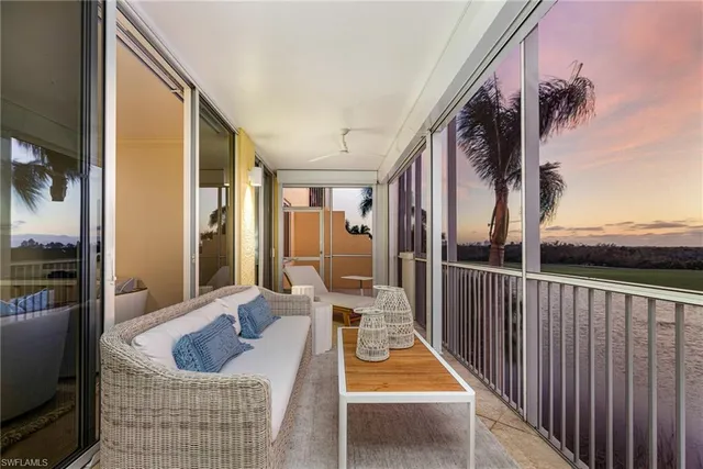 a front view of a house with outdoor seating