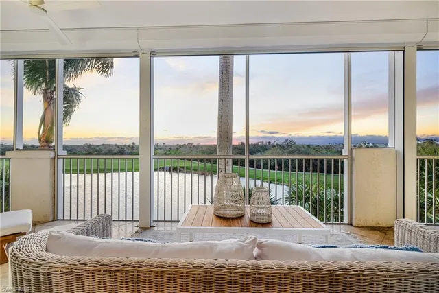 a view of a room with a table and chairs