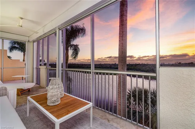 a view of a balcony with floor to ceiling window wooden floor