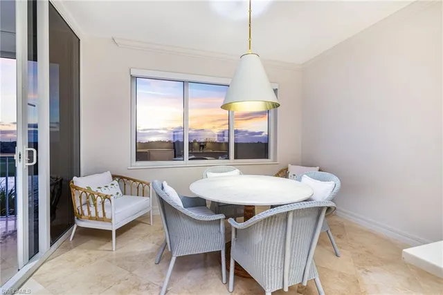 a view of a dining room with furniture window and outside view