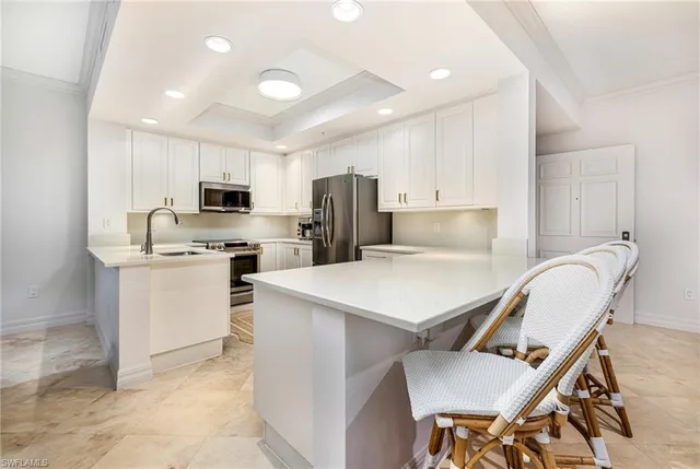 a kitchen that has a cabinets counter space and appliances