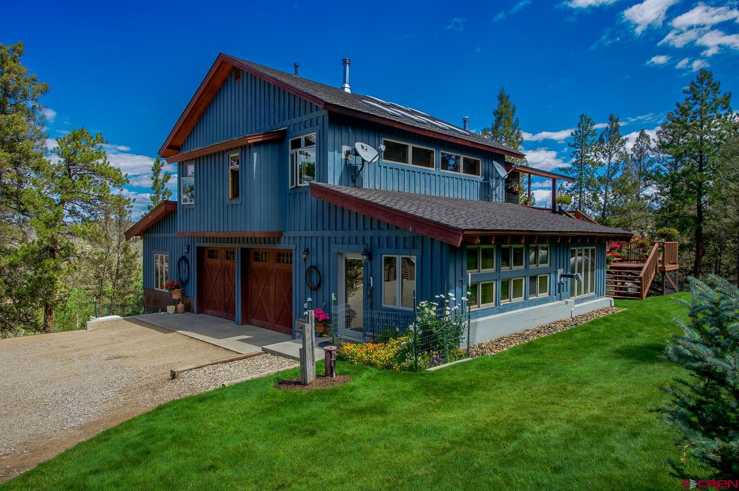 7750 High Country Road Gunnison, CO 81230 - Photo 1 of 1 In-floor radiant heat, landscaped, views, solar, greenhouse, shop, 2 car attached heated garage.