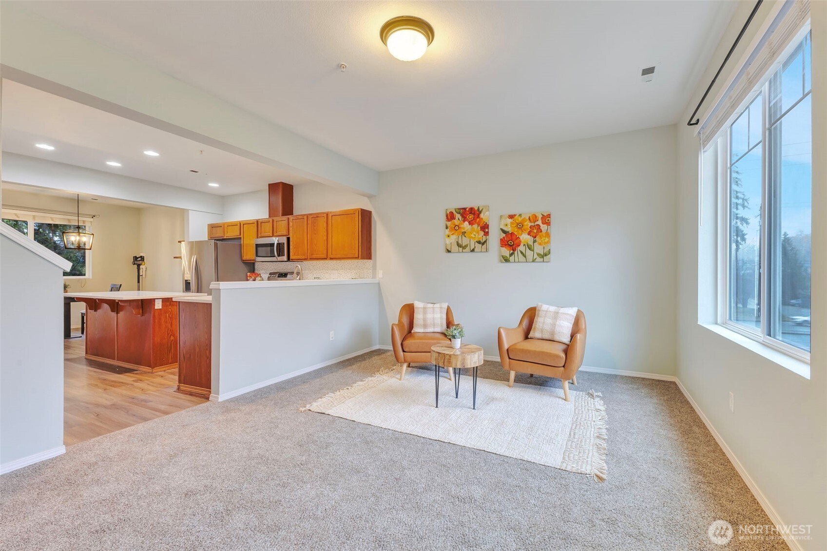 5319 147th St Court East, Unit 5 Tacoma, WA 98446 - Photo 13 of 30 a living room with furniture and a wooden floor
