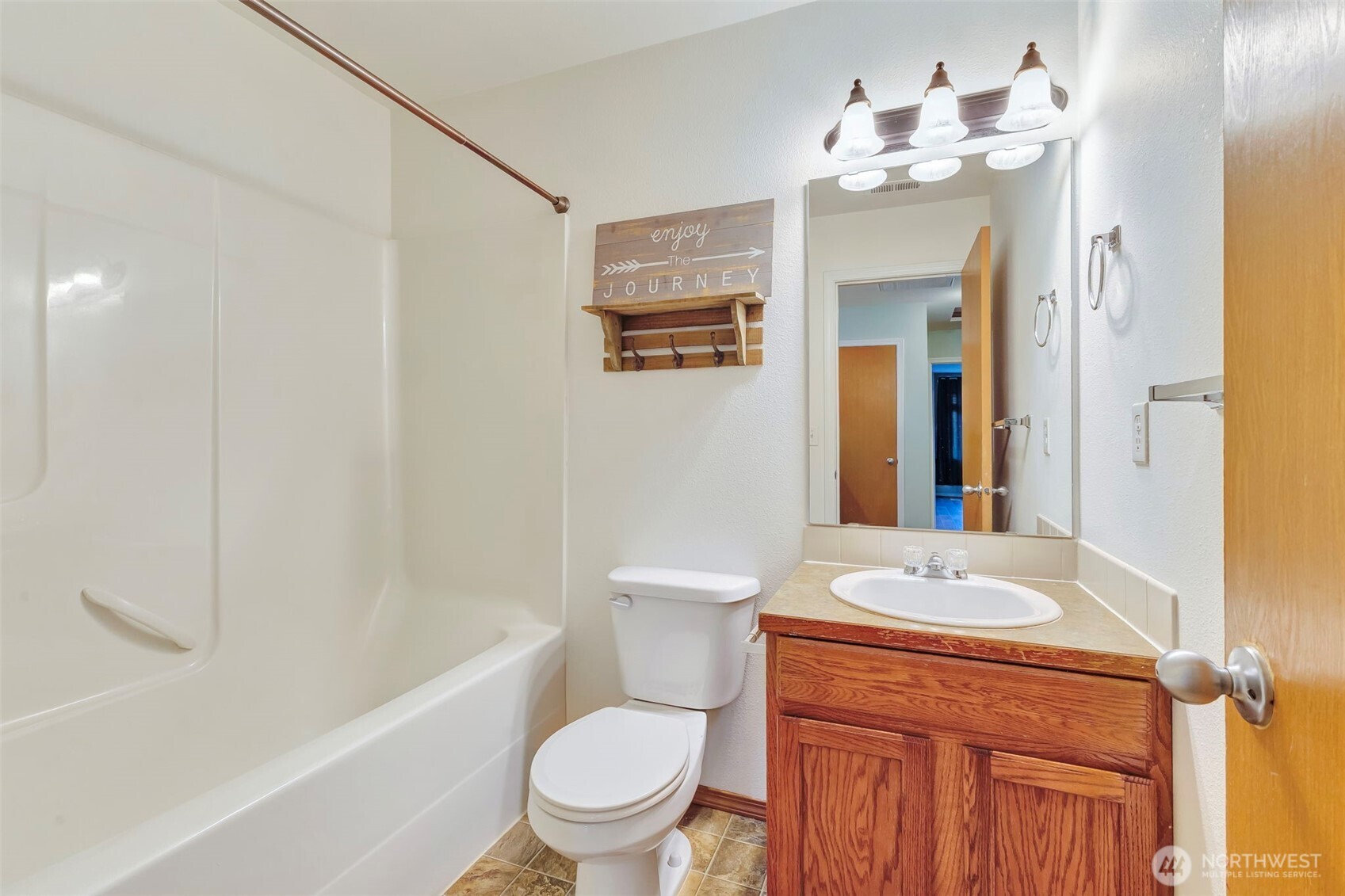 5319 147th St Court East, Unit 5 Tacoma, WA 98446 - Photo 15 of 30 a bathroom with a sink a toilet and shower