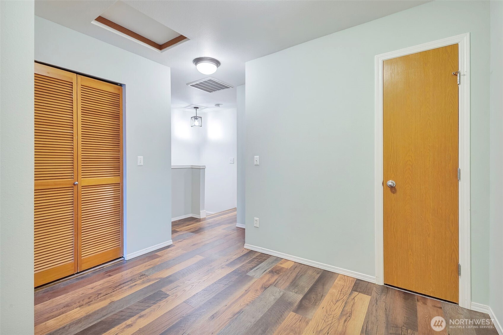 5319 147th St Court East, Unit 5 Tacoma, WA 98446 - Photo 21 of 30 an empty room with wooden floor and a window
