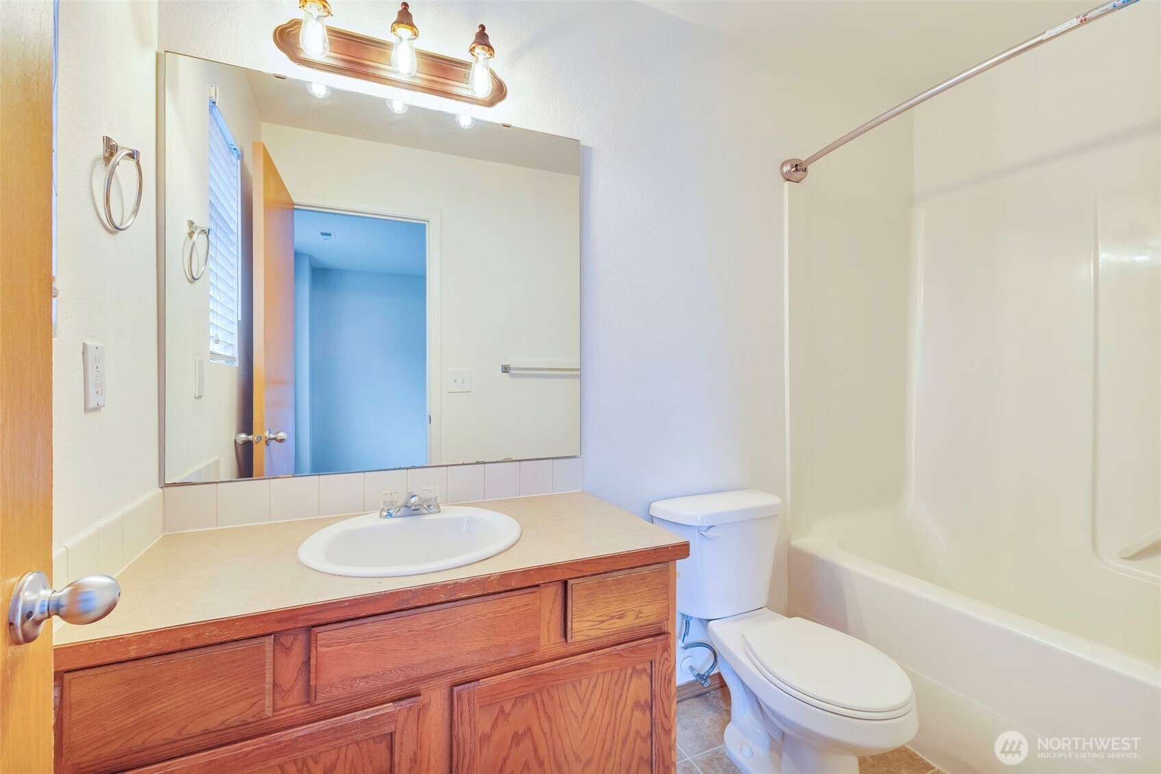 5319 147th St Court East, Unit 5 Tacoma, WA 98446 - Photo 25 of 30 a bathroom with a sink a toilet and shower