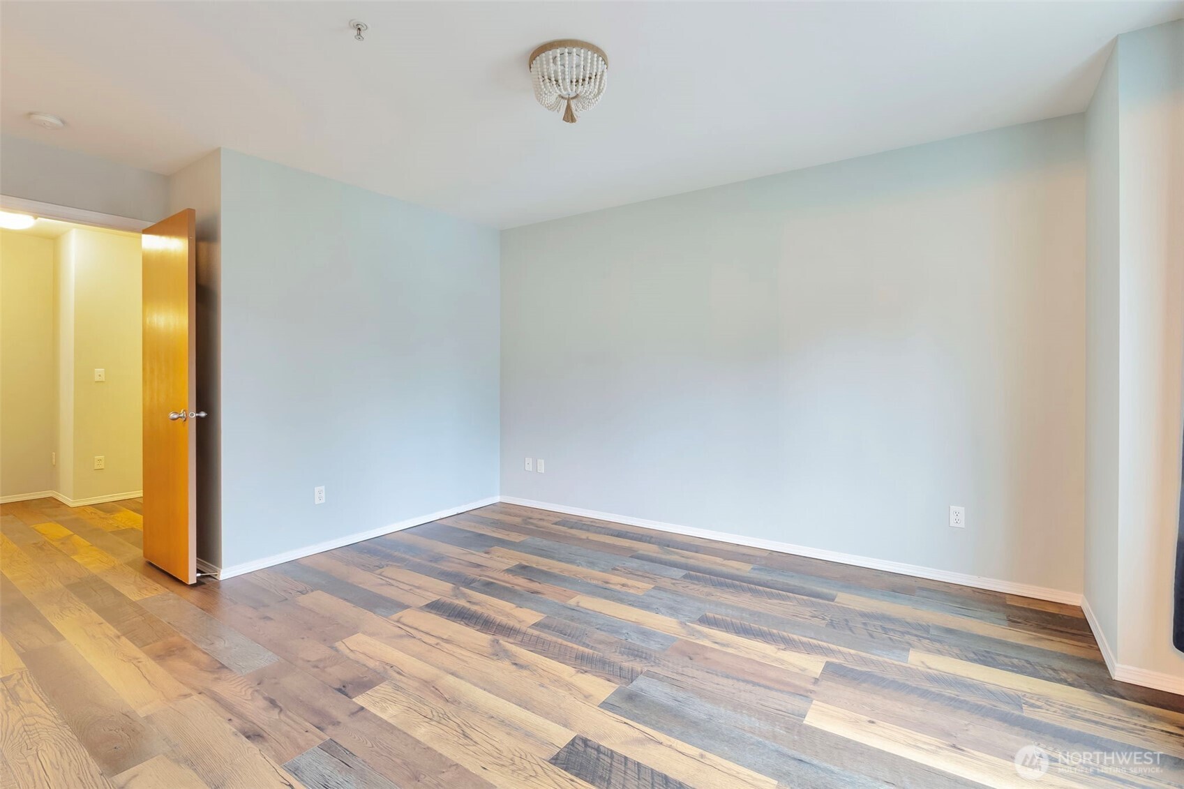 5319 147th St Court East, Unit 5 Tacoma, WA 98446 - Photo 26 of 30 a view of a room with wooden floor