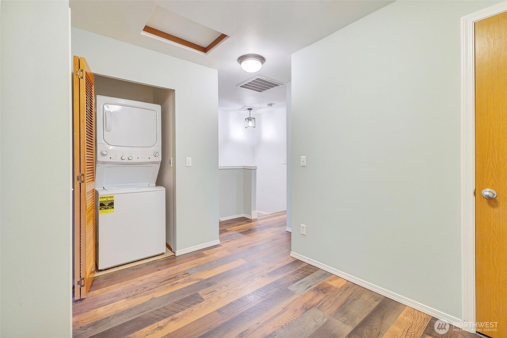 5319 147th St Court East, Unit 5 Tacoma, WA 98446 - Photo 27 of 30 a view of a hallway with wooden floor