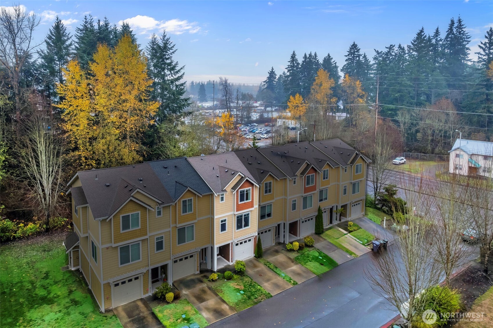 5319 147th St Court East, Unit 5 Tacoma, WA 98446 - Photo 3 of 30 a aerial view of a house with a yard in front of it