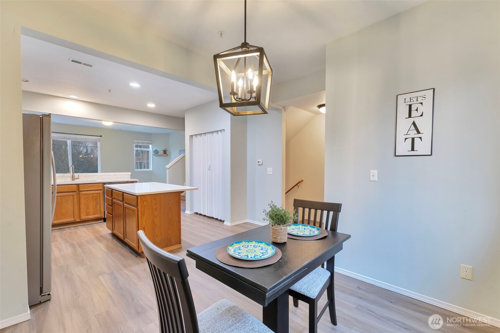 5319 147th St Court East, Unit 5 Tacoma, WA 98446 - Photo 9 of 30 a view of a dining room with furniture and wooden floor