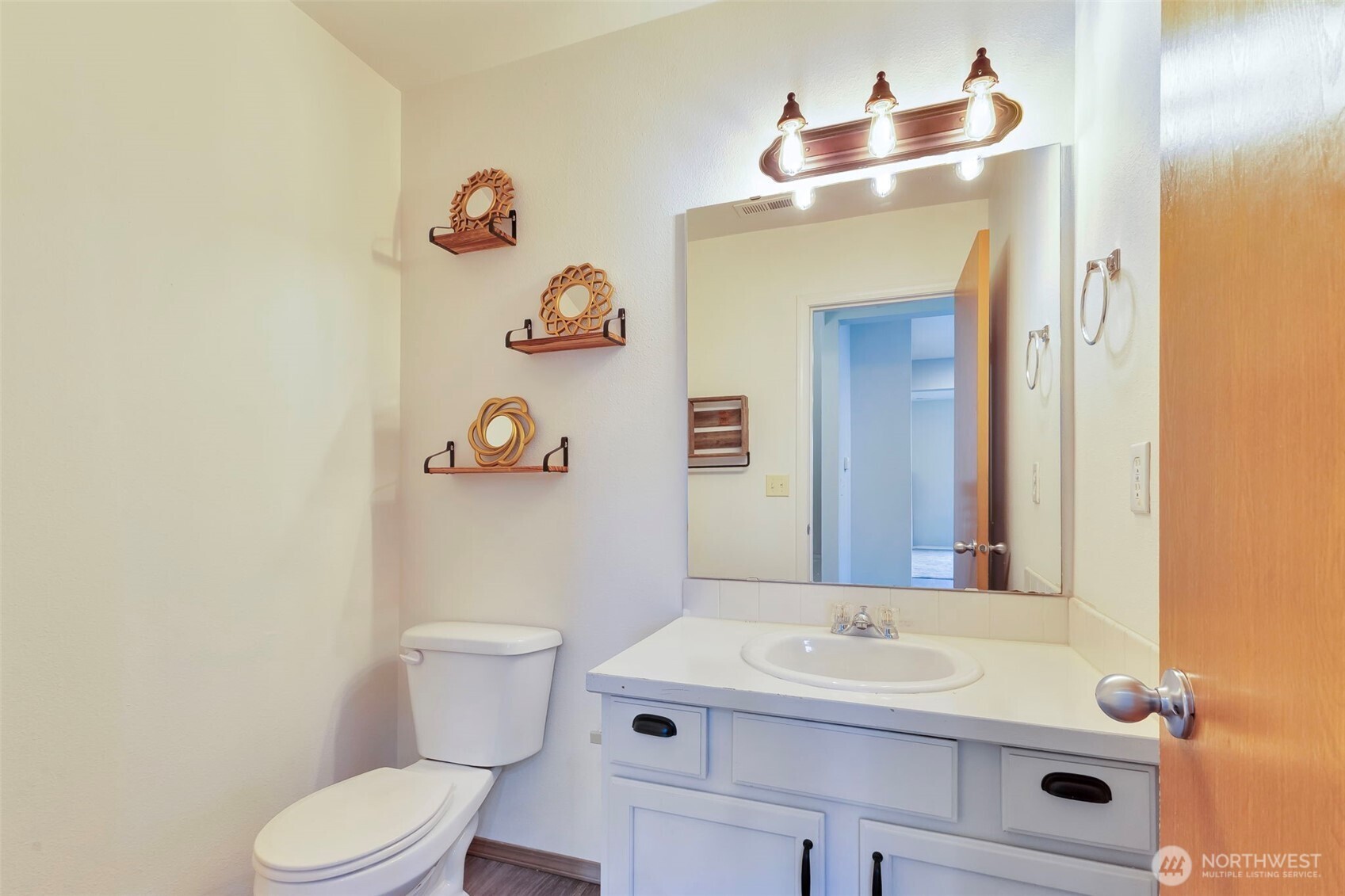 5319 147th St Court East, Unit 5 Tacoma, WA 98446 - Photo 10 of 30 a bathroom with a sink a toilet and a mirror
