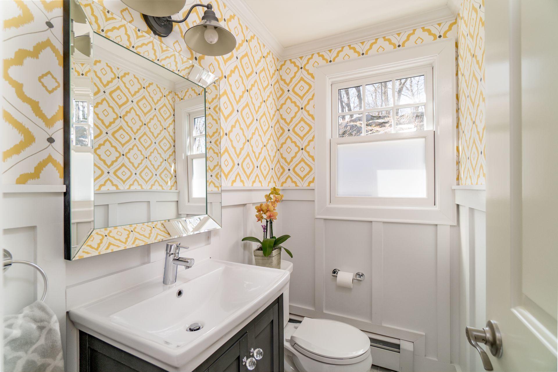 17 Steeple Top Road Rowayton, CT 06853 - Photo 16 of 37 a bathroom with a sink a toilet and a mirror