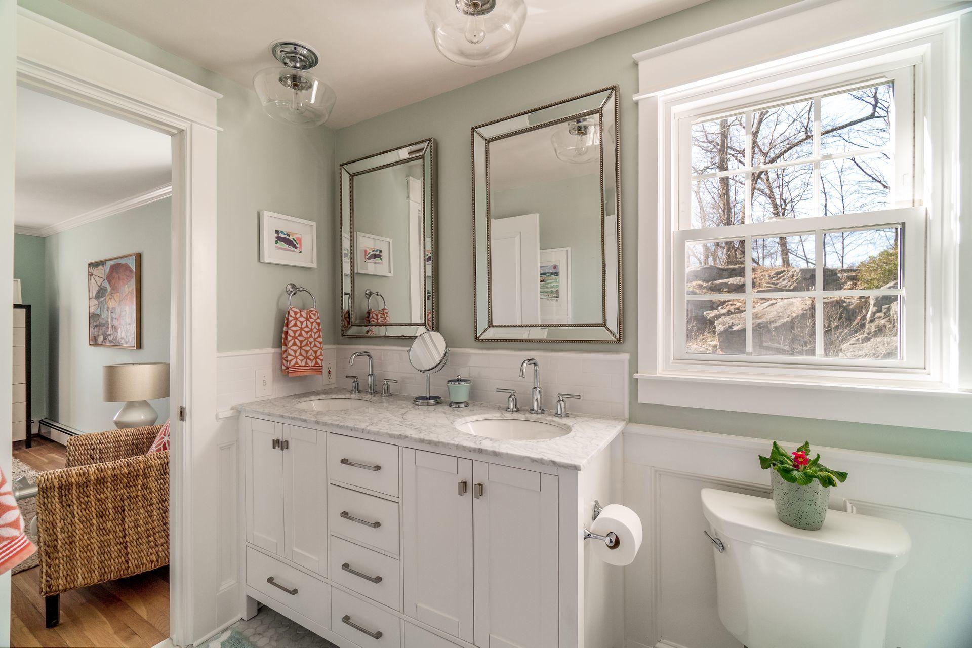 17 Steeple Top Road Rowayton, CT 06853 - Photo 23 of 37 a bathroom with a granite countertop sink mirror and window